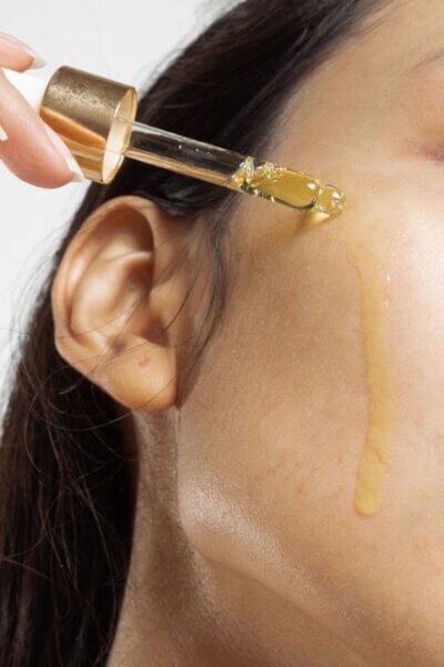 vitamin c being applied to face